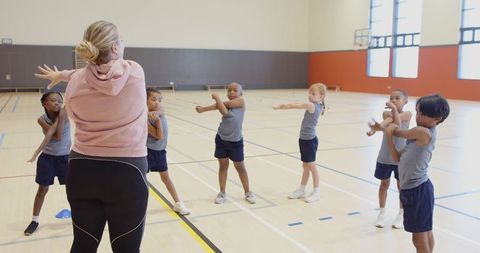 Energetic Gym Class Stretching Routine Led by Coach