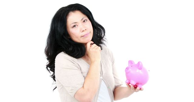 Woman Contemplating Savings with Piggy Bank Isolated on White - Download Free Stock Images Pikwizard.com