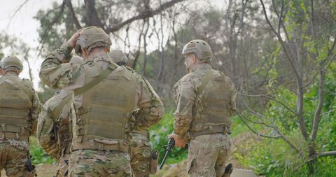 Caucasian Soldiers in Camouflage Discussing Mission Outdoors - Download Free Stock Images Pikwizard.com