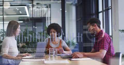 Multicultural Team Analyzing Business Data in Modern Office