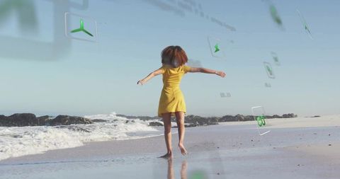 Walking toward ocean with augmented reality hud overlays on sunny beach coastline