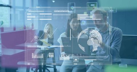 Colleagues Collaborating on Digital Data in Modern Office