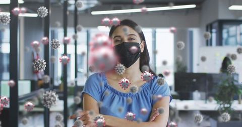 Woman Wearing Mask with Floating Virus Cells in Office Environment