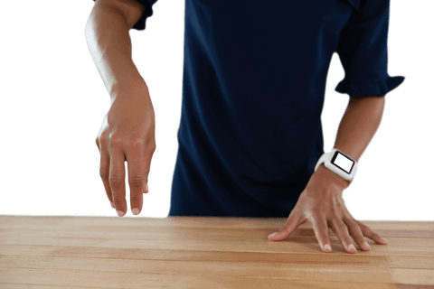 Businesswoman operating invisible interface on transparent surface