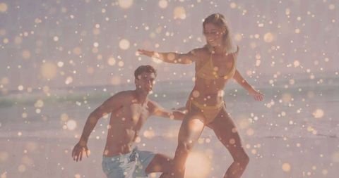 Carefree Couple Enjoying Playful Moments on Beach
