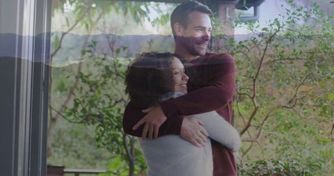 Cozy Couple Embracing on Rustic Porch Surrounded by Nature
