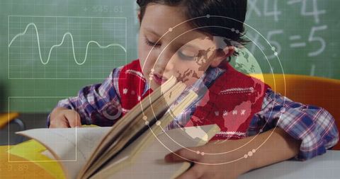 Innovative Learning: Student Engaged with Book in Technological Classroom