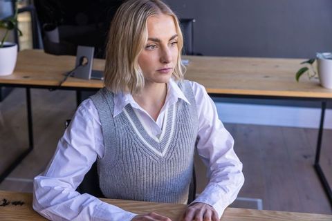 Women Executive in Stylish Office Setting Focused on Monitor