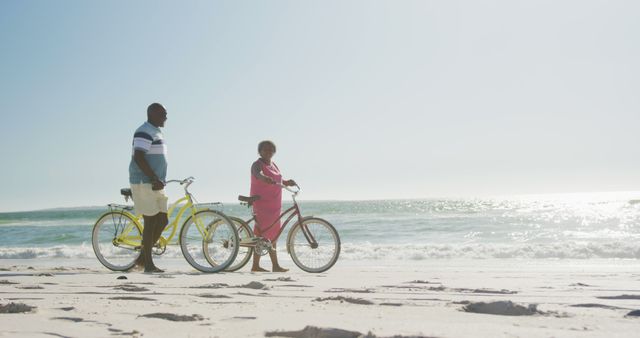 Senior African American Couple Enjoying Leisurely Bike Ride on Beach - Download Free Stock Images Pikwizard.com