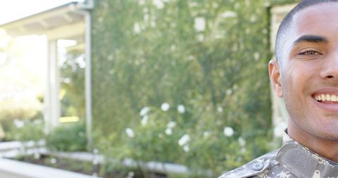 Smiling Biracial Soldier in Garden Outdoor Portrait