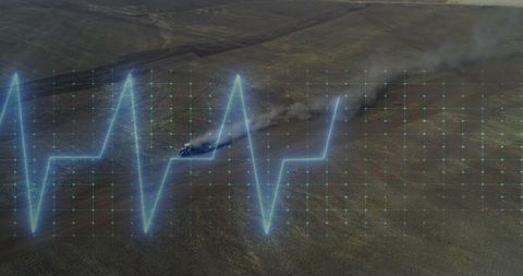 Futuristic ecg overlay on dusty landscape with off-road adventure