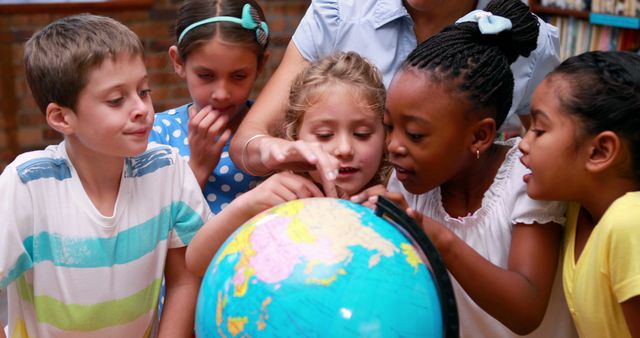 Diverse Group of Children Learning with Globe in Classroom - Download Free Stock Images Pikwizard.com