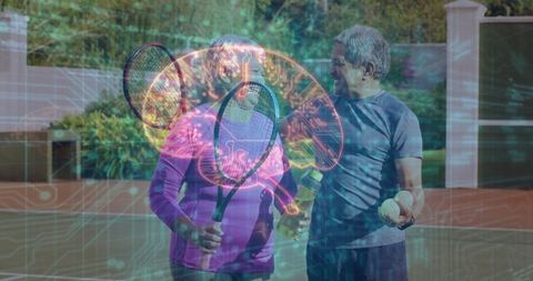 Active Senior Couple with Rackets Enjoying Tennis at Vibrant Outdoor Court