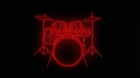 Red neon drum kit illuminating dark wall interior