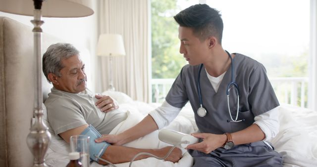 Nurse Checking Blood Pressure of Senior Man at Home - Download Free Stock Images Pikwizard.com