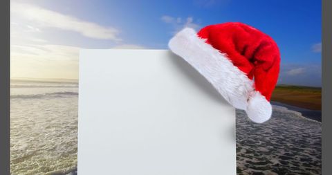 Santa Hat on Blank Card by Ocean in Seaside Winter Wonderland