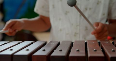 Young Student Playing Xylophone in Classroom - Download Free Stock Images Pikwizard.com