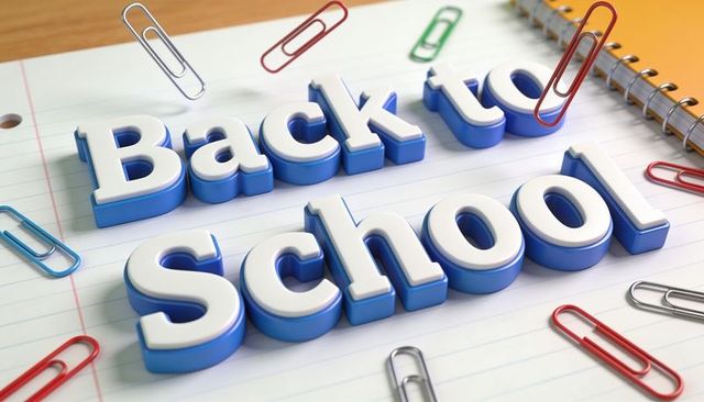 Back to school 3d lettering on lined notebook with colorful paperclips and stationery