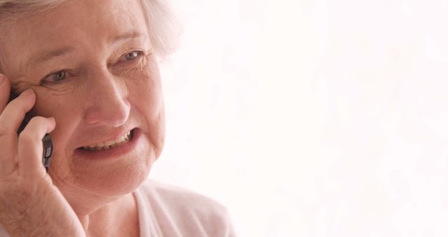 Elderly Woman Expressing Concern While Talking on Phone - Download Free Stock Images Pikwizard.com