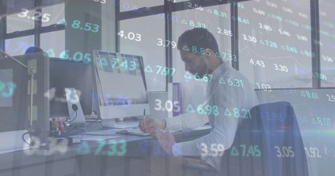 Young Businessman Analyzing Financial Data in Modern Office - Download Free Stock Images Pikwizard.com