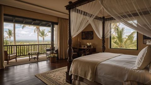 Carved Four-Poster Canopy Bed in Luxury Tropical Suite with Balcony and Ocean View