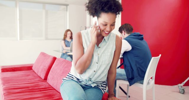 Young Woman Talking on Phone in Modern Co-working Space - Download Free Stock Images Pikwizard.com