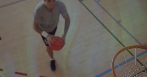 Athlete Focusing on Basketball Hoop During Gameplay