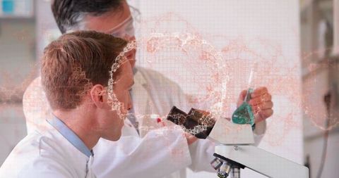 Mentor-guided scientists peering into microscope holding green flask, collaborative lab research