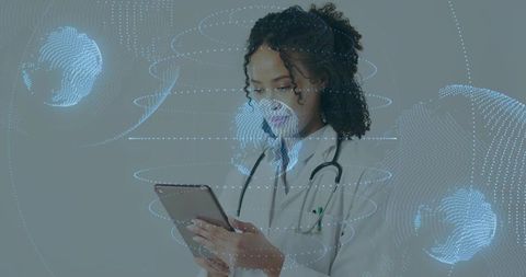 Clinician using tablet with holographic global data visualization for telemedicine