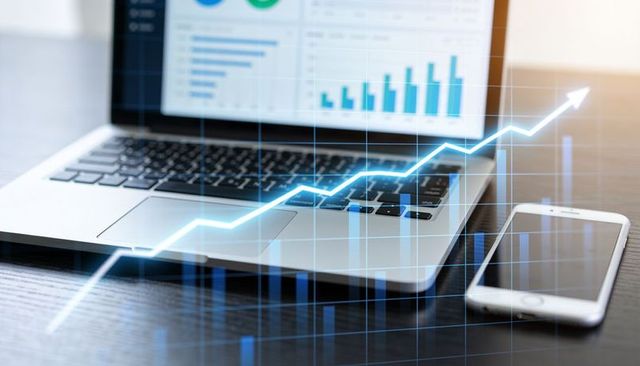 Laptop smartphone displaying financial data dashboard with rising growth chart overlay