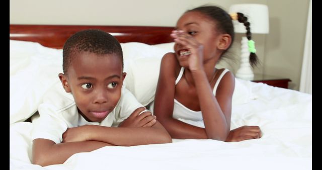 Siblings Enjoying Time Together on Bed - Download Free Stock Images Pikwizard.com