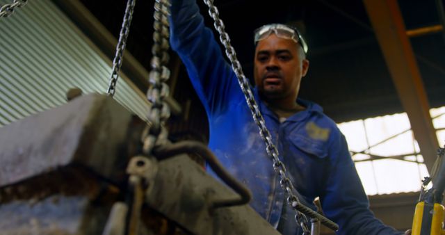 Male Factory Worker Operating Heavy Machinery in Industrial Facility - Download Free Stock Images Pikwizard.com