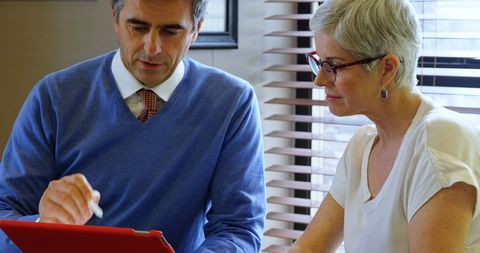 Business Meeting with Digital Tablet in Office