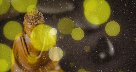 Buddha Statue with Glowing Lights on Dark Background