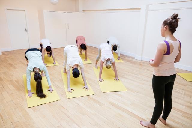 Yoga Instructor Leading Group Class in Studio - Download Free Stock Images Pikwizard.com