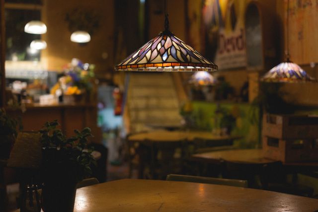 Cozy Cafe with Stained Glass Lamp and Vintage Decor - Download Free Stock Photos Pikwizard.com