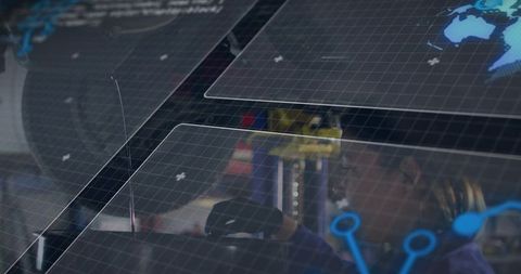 Female Technician Operating Industrial Automation Console with Augmented Reality Grid