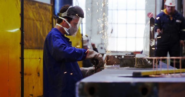 Worker Grinding Metal in Industrial Workshop with Safety Gear - Download Free Stock Images Pikwizard.com