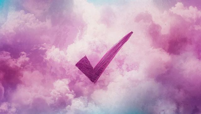 Whimsical Violet Check Mark Over Pastel Clouds Sky