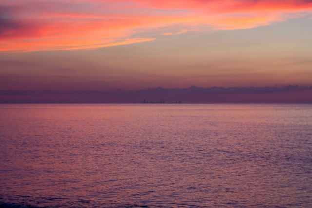 Serene Sunset Over Calm Ocean Waters Creating Warm Romantic Ambiance - Download Free Stock Photos Pikwizard.com