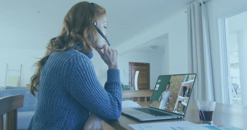 Woman in Videocall Using Laptop at Home with Biometric Security Feature