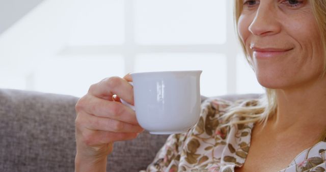 Smiling Woman Enjoying Morning Tea in Cozy Home Setting - Download Free Stock Images Pikwizard.com