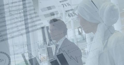 Business Dialogue Surrounded by Financial Data and Graphs