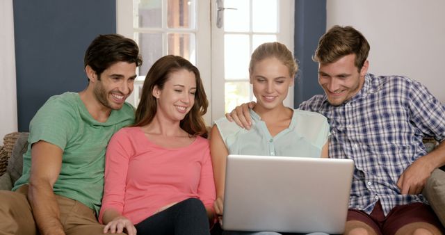 Friends Sitting on Sofa Using Laptop at Home - Download Free Stock Images Pikwizard.com