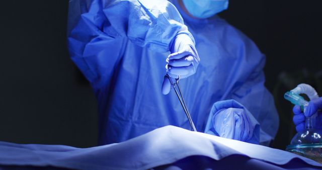 Surgeon in Blue Scrubs Performing Surgery in Operating Room - Download Free Stock Images Pikwizard.com