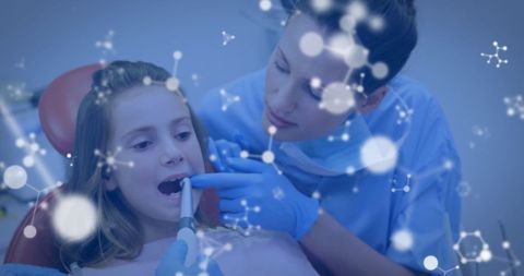 Child Patient Receiving Dental Care with Overlay of Molecular Structures