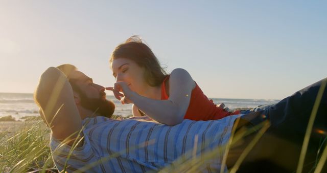 Romantic Couple Relaxing on Beach Grass During Sunset - Download Free Stock Images Pikwizard.com