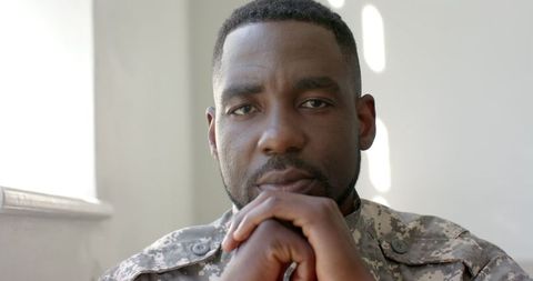 Contemplative Soldier Deep in Thought at Home - Download Free Stock Images Pikwizard.com