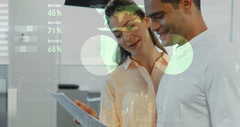 Colleagues Analyzing Business Data in Modern Office Setting