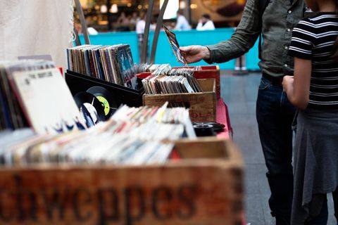 People browsing vinyl records at street market